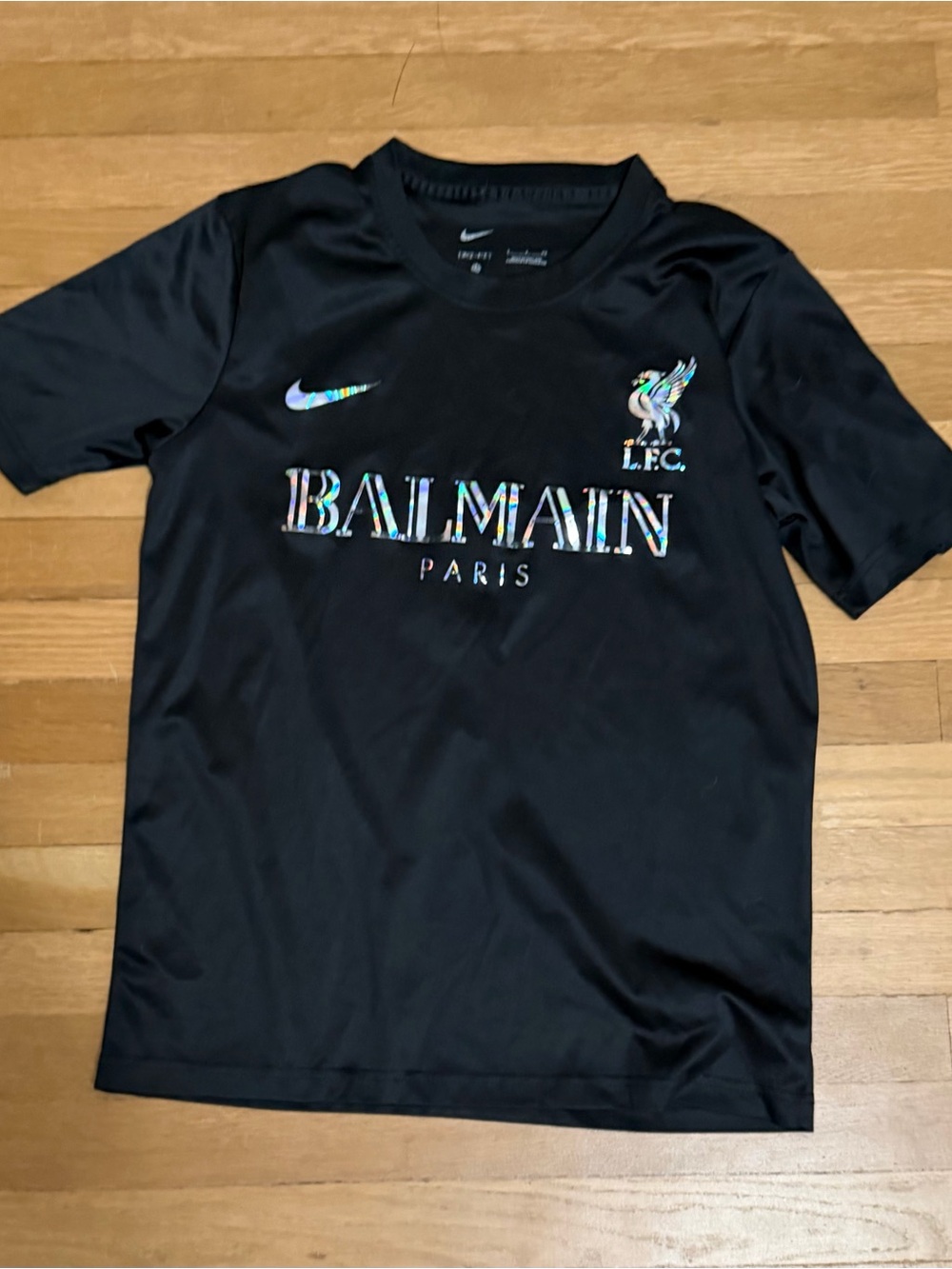Nike Kids Black Tee with Iridescent Logo Accents